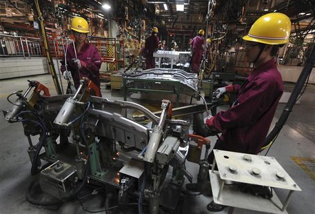 Employees weld automobiles at Anhui Jianghuai Automobile Co. Ltd (JAC Motors) in Hefei Employees weld automobiles at Anhui Jianghuai Automobile Co. Ltd (JAC Motors) in Hefei