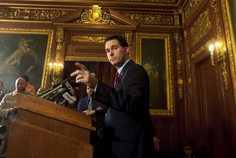 Wisconsin Republican Governor Walker speaks to the media about his proposed budget cuts reducing public employee union bargaining powers and Wisconsin Republican Governor Walker speaks to the media about his proposed budget cuts reducing public employee union bargaining powers and