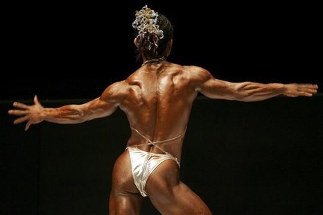 A female bodybuilder competes during the Hong Kong Bodybuilding Championships A female bodybuilder competes during the Hong Kong Bodybuilding Championships