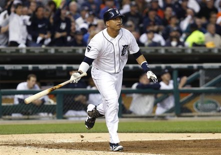 Detroit Tigers' Victor Martinez watches his RBI triple against the Texas Rangers in Game 5 in their MLB ALCS baseball playoffs in Detroit Detroit Tigers' Victor Martinez watches his RBI triple against the Texas Rangers in Game 5 in their MLB ALCS baseball playoffs in Detroit