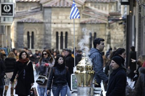 A man sells salepi beverage during the first day of the official sales season at a commercial street in Athens. A man sells salepi beverage during the first day of the official sales season at a commercial street in Athens.