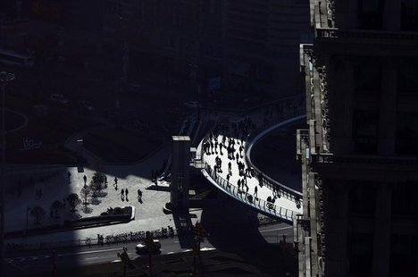 People walks at the financial district of Pudong in Shanghai. People walks at the financial district of Pudong in Shanghai.