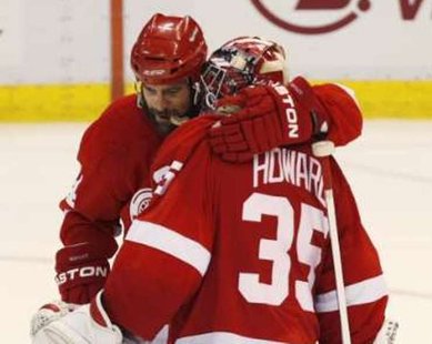 Detroit Red Wings right wing Todd Bertuzzi (44) hugs goalie Jimmy Howard (35) after a win. REUTERS/Rebecca Cook Detroit Red Wings right wing Todd Bertuzzi (44) hugs goalie Jimmy Howard (35) after a win. REUTERS/Rebecca Cook