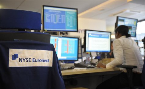 An expert works at her screens in the NYSE Euronext cash market operations room in Paris An expert works at her screens in the NYSE Euronext cash market operations room in Paris