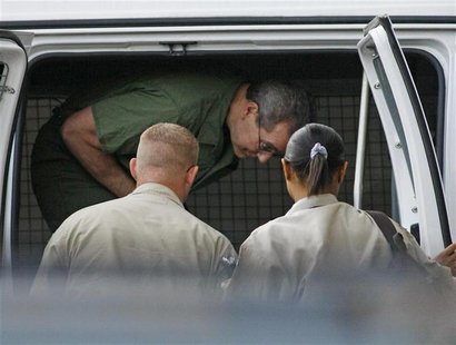 R. Allen Stanford exits a van upon arriving at federal court for a hearing before U.S. District Judge Nancy Atlas in Houston
