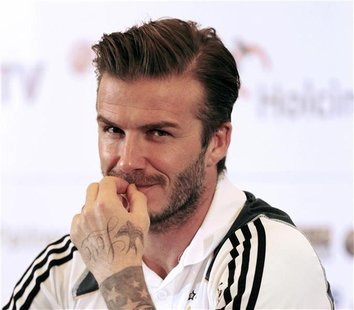 Los Angeles Galaxy's David Beckham reacts during a news confrence in Jakarta Los Angeles Galaxy's David Beckham reacts during a news confrence in Jakarta