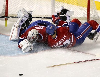 Canadiens Pacioretty collides with goalie Price during third period NHL hockey action against Capitals in Montreal. Canadiens Pacioretty collides with goalie Price during third period NHL hockey action against Capitals in Montreal.