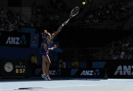Kvitova of Czech Republic serves to Navarro of Spain at the Australian Open tennis tournament in Melbourne Kvitova of Czech Republic serves to Navarro of Spain at the Australian Open tennis tournament in Melbourne