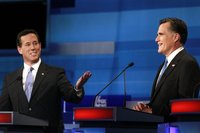 Republican presidential candidate (L) former U.S. Senator Rick Santorum (R-PA) makes a point as former Massachusetts Governor Mitt Romney li