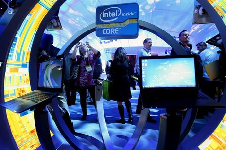 A woman takes a photo of ultrabooks at the Intel booth during the 2012 International Consumer Electronics Show in Las Vegas A woman takes a photo of ultrabooks at the Intel booth during the 2012 International Consumer Electronics Show in Las Vegas