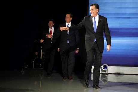 Republican presidential candidates Romney, Santorum and Perry arrive on stage to participate in a Republican presidential candidates debate Republican presidential candidates Romney, Santorum and Perry arrive on stage to participate in a Republican presidential candidates debate