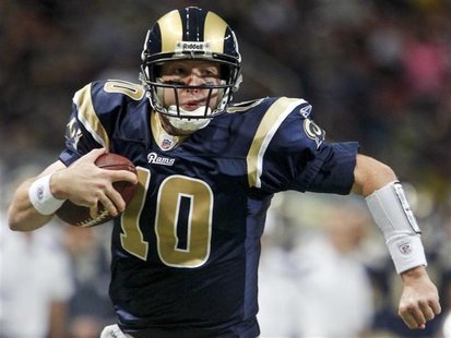 St. Louis Rams quarterback Kellen Clemens runs the ball in for a touchdown during the first half of their NFL football game against the San 
