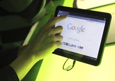 The Google home page is shown on Google's latest version of the Android operating system, Honeycomb, on a Motorola Xoom tablet device in Mou The Google home page is shown on Google's latest version of the Android operating system, Honeycomb, on a Motorola Xoom tablet device in Mou