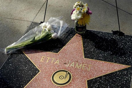 Flowers placed by fans sit atop the the Hollywood Walk of Fame star of singer Etta James who has died