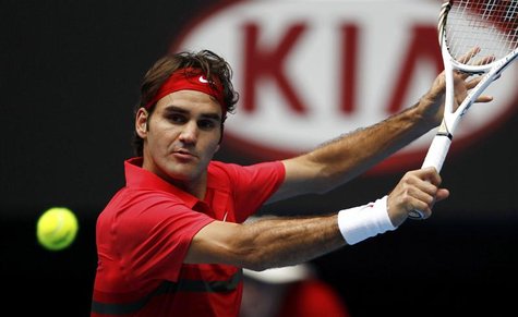 Federer of Switzerland hits a return to Karlovic of Croatia at the Australian Open tennis tournament in Melbourne Federer of Switzerland hits a return to Karlovic of Croatia at the Australian Open tennis tournament in Melbourne
