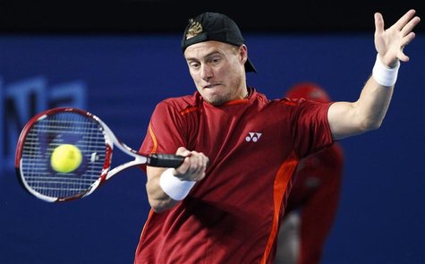 Hewitt of Australia hits a return to Raonic of Canada during their men's singles match at the Australian Open tennis tournament in Melbourne Hewitt of Australia hits a return to Raonic of Canada during their men's singles match at the Australian Open tennis tournament in Melbourne