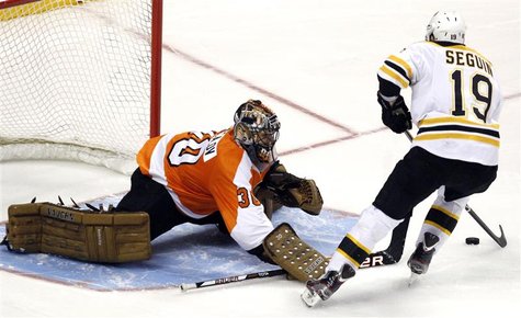 Bruins Seguin shoots the game winning goal past the Flyers goalie Bryzgalov during the shootout period of their NHL ice hockey game in Phila Bruins Seguin shoots the game winning goal past the Flyers goalie Bryzgalov during the shootout period of their NHL ice hockey game in Phila
