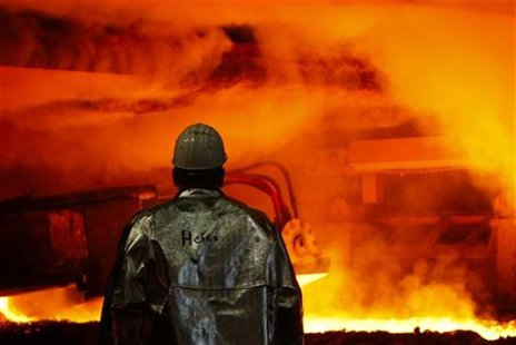 A worker of German steelmaker ThyssenKrupp controls a blast furnace in Duisburg