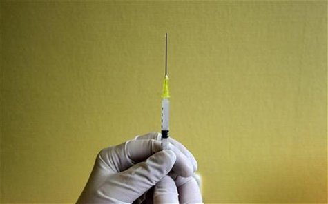 A nurse prepares a H1N1 flu vaccine shot at a hospital in Budapest A nurse prepares a H1N1 flu vaccine shot at a hospital in Budapest