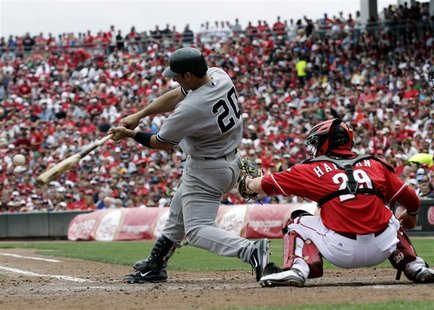 New York Yankees' Posada hits a two run home run off of Cincinnati Reds' Leake during their interleague MLB baseball game in Cincinnati New York Yankees' Posada hits a two run home run off of Cincinnati Reds' Leake during their interleague MLB baseball game in Cincinnati