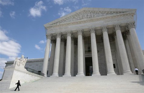 Security guards walk the steps of the Supreme Court in Washington Security guards walk the steps of the Supreme Court in Washington