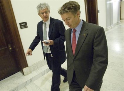 Paul walks with a reporter outside of his office on Capitol Hill in Washington Paul walks with a reporter outside of his office on Capitol Hill in Washington
