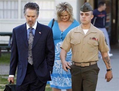 File photo shows Marine Corps Staff Sgt. Wuterich arriving for a pre-trial hearing with his lawyer and girlfriend at Camp Pendleton, Califor File photo shows Marine Corps Staff Sgt. Wuterich arriving for a pre-trial hearing with his lawyer and girlfriend at Camp Pendleton, Califor