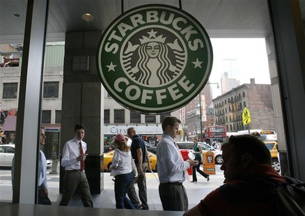 File photo of people walking past the Starbucks outlet on 47th and 8th Avenue in New York File photo of people walking past the Starbucks outlet on 47th and 8th Avenue in New York