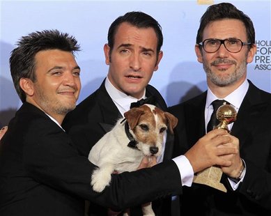 Langmann, Dujardin and Hazanavicius of the film "The Artist" pose backstage at the 69th annual Golden Globe Awards in Beverly Hills Langmann, Dujardin and Hazanavicius of the film "The Artist" pose backstage at the 69th annual Golden Globe Awards in Beverly Hills