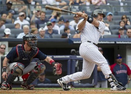 New York Yankees Jorge Posada hits two-run home run in front of Boston Red Sox Jarrod Saltalamacchia in their MLB game in New York New York Yankees Jorge Posada hits two-run home run in front of Boston Red Sox Jarrod Saltalamacchia in their MLB game in New York