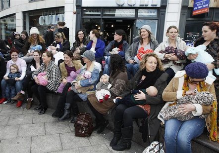 Mothers feed their babies during a breastfeeding flashmob in Brighton town centre southern England Mothers feed their babies during a breastfeeding flashmob in Brighton town centre southern England