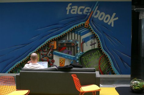 An employee works on a computer at the new headquarters of Facebook in Menlo Park An employee works on a computer at the new headquarters of Facebook in Menlo Park