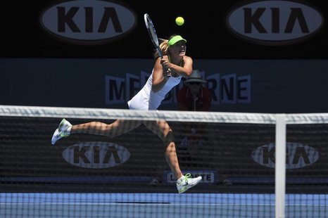 Sharapova of Russia hits a return to Makarova of Russia during their quarter-final match at the Australian Open in Melbourne Sharapova of Russia hits a return to Makarova of Russia during their quarter-final match at the Australian Open in Melbourne