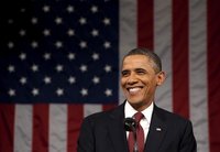 U.S. President Obama pauses during his State of the Union address to a joint session of Congress on Capitol Hill in Washington