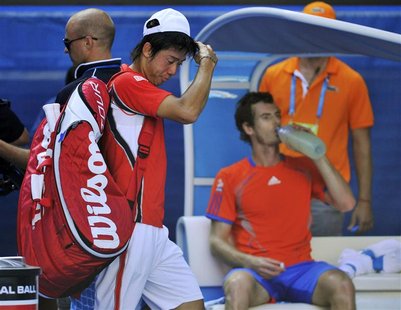 Nishikori of Japan leaves after he was defeated by Murray of Britain in their men's singles quarter-final match at the Australian Open in Me Nishikori of Japan leaves after he was defeated by Murray of Britain in their men's singles quarter-final match at the Australian Open in Me