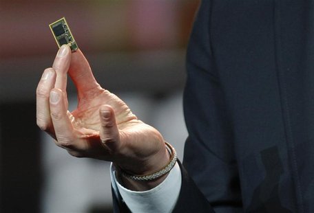 Vestberg, president and CEO of Ericsson Group, holds a ST-Ericsson 4G LTE chip during his keynote address at the 2012 International CES in L Vestberg, president and CEO of Ericsson Group, holds a ST-Ericsson 4G LTE chip during his keynote address at the 2012 International CES in L