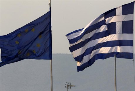 A Greek and an EU flag fly over the Greece's Finance Ministry in Athens A Greek and an EU flag fly over the Greece's Finance Ministry in Athens
