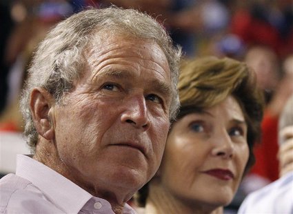 Former U.S. President George W. Bush and former first lady Laura Bush watch Game 1 of the MLB American League Championship Series baseball p Former U.S. President George W. Bush and former first lady Laura Bush watch Game 1 of the MLB American League Championship Series baseball p