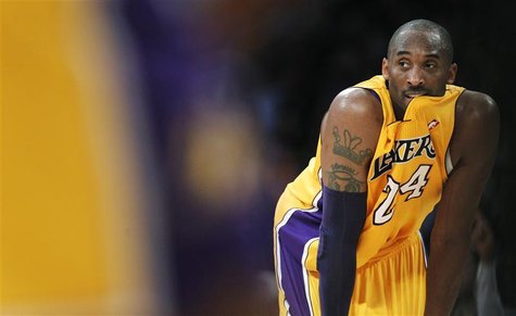 Los Angeles Lakers' Kobe Bryant looks on against the New York Knicks during second half of an NBA basketball game in Los Angeles Los Angeles Lakers' Kobe Bryant looks on against the New York Knicks during second half of an NBA basketball game in Los Angeles