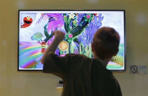 A boy plays at the Nintendo exhibition stand during the Gamescom 2011 fair in Cologne A boy plays at the Nintendo exhibition stand during the Gamescom 2011 fair in Cologne