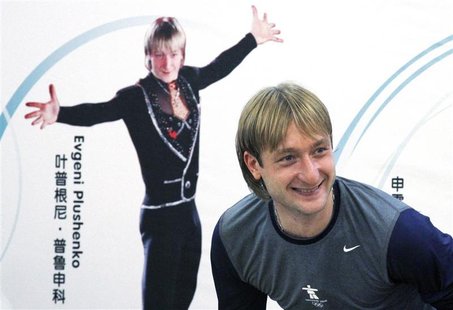 Former Olympic champion figure skater Plushenko of Russia smiles as he leaves a news conference in Beijing Former Olympic champion figure skater Plushenko of Russia smiles as he leaves a news conference in Beijing
