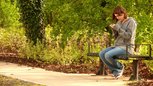 Girl Texting in Park