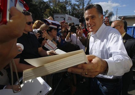 Republican presidential candidate and former Massachusetts Governor Mitt Romney signs autographs during a campaign stop at Paramount Printin Republican presidential candidate and former Massachusetts Governor Mitt Romney signs autographs during a campaign stop at Paramount Printin