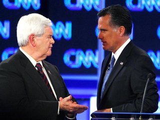 Republican presidential candidate former Speaker of the House Newt Gingrich talks with Massachusetts Governor Mitt Romney during a break in 