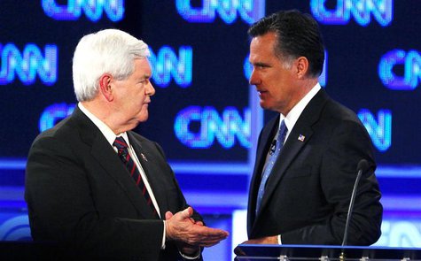 Republican presidential candidate former Speaker of the House Newt Gingrich talks with Massachusetts Governor Mitt Romney during a break in 