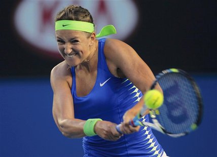Azarenka of Belarus hits a return to Sharapova of Russia during their women's singles final match at the Australian Open tennis tournament i Azarenka of Belarus hits a return to Sharapova of Russia during their women's singles final match at the Australian Open tennis tournament i