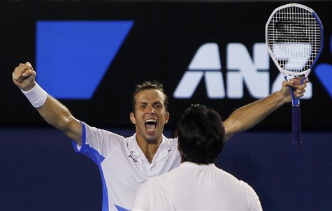 Stepanek of Czech Republic celebrates with his partner Paes of India after they defeated Bob and Mike Bryan of the United States Stepanek of Czech Republic celebrates with his partner Paes of India after they defeated Bob and Mike Bryan of the United States