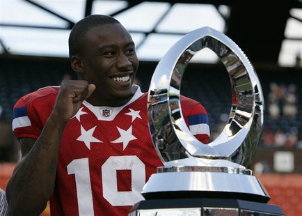 AFC wide receiver Brandon Marshall of the Miami Dolphins celebrates with the trophy after being named MVP of the NFL Pro Bowl at Aloha Stadi AFC wide receiver Brandon Marshall of the Miami Dolphins celebrates with the trophy after being named MVP of the NFL Pro Bowl at Aloha Stadi