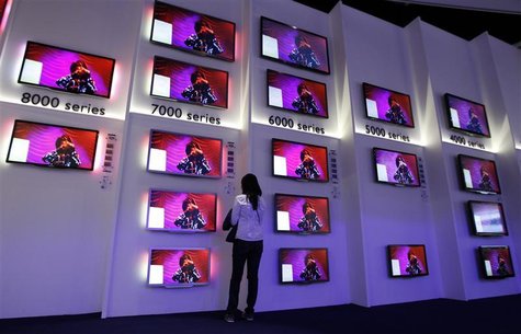 Woman looks at flat screen TV sets in Philips pavilion before opening of the IFA consumer electronics fair in Berlin Woman looks at flat screen TV sets in Philips pavilion before opening of the IFA consumer electronics fair in Berlin