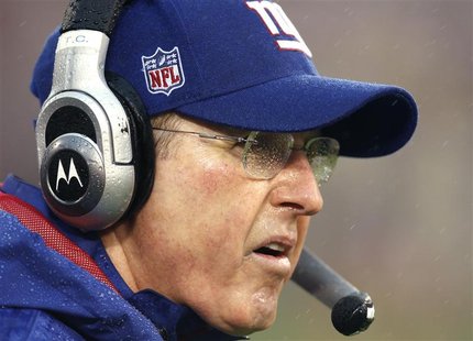 New York Giants coach Coughlin's eyeglasses are splattered with rain has he looks on from the sidelines during the NFL NFC Championship game New York Giants coach Coughlin's eyeglasses are splattered with rain has he looks on from the sidelines during the NFL NFC Championship game